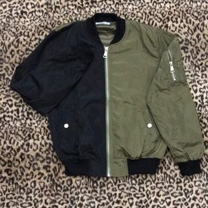 Olive green & black windbreaker .